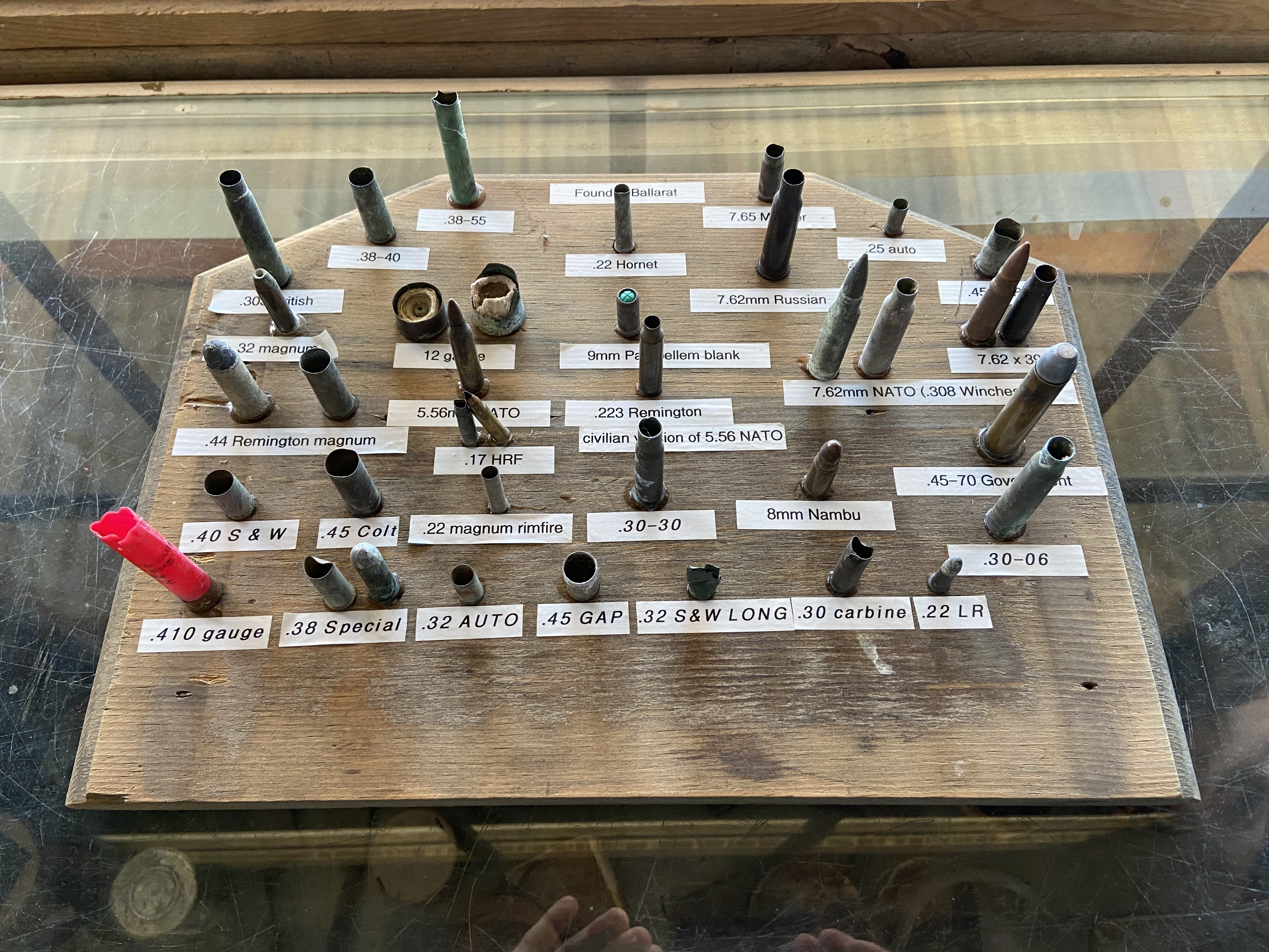 Flyers/photos/articles framed on a wall.