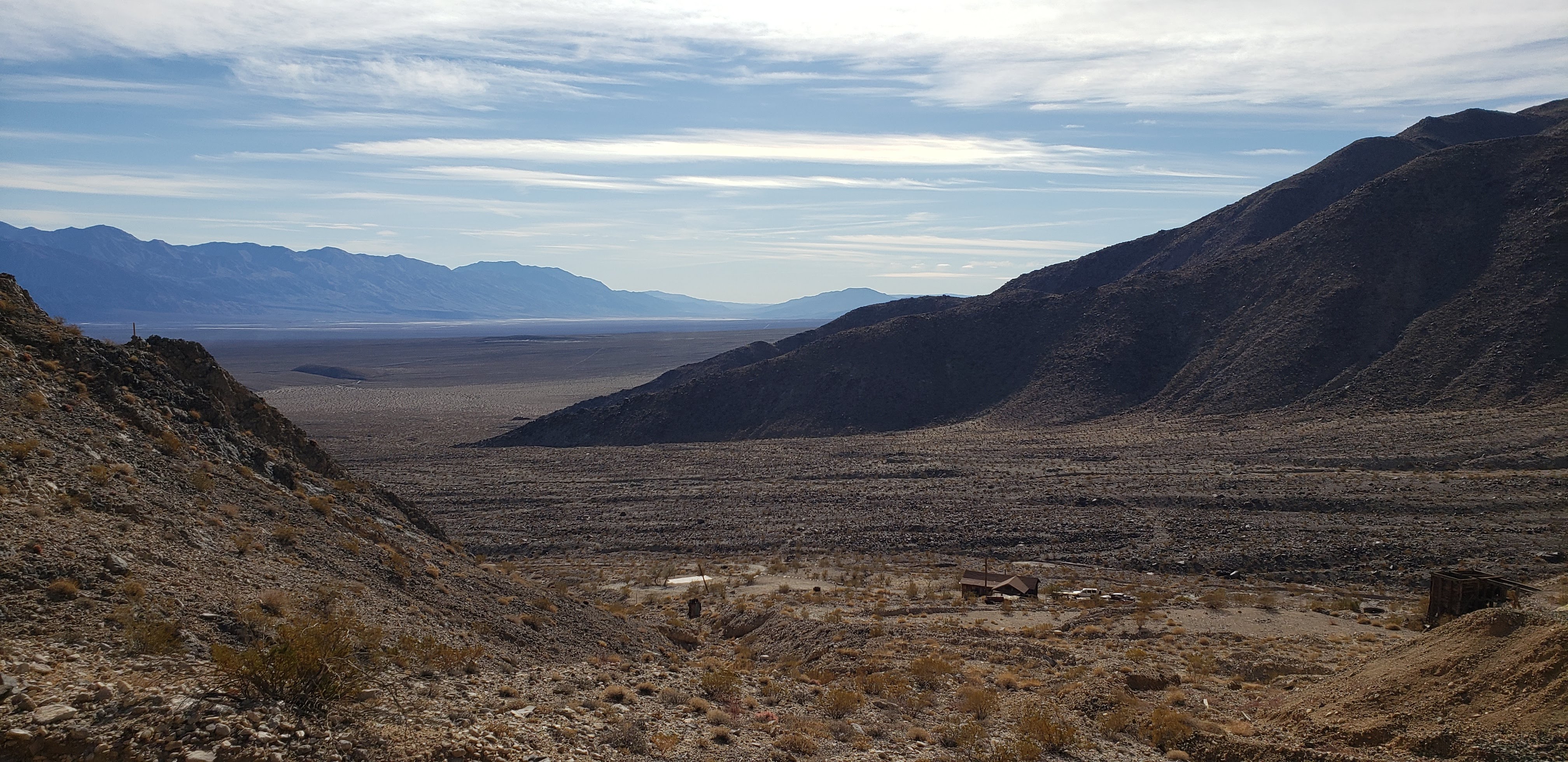 View of the cabin from the workings on the hill behind it.